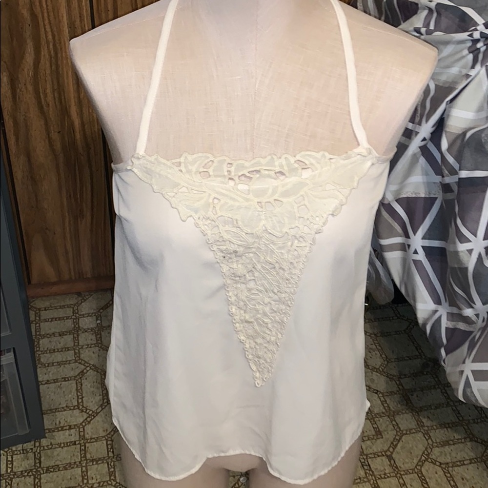 Cream colored top, with flower detail, medium